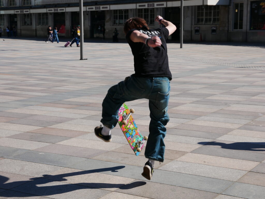 Skateboarder practicing a kickflip