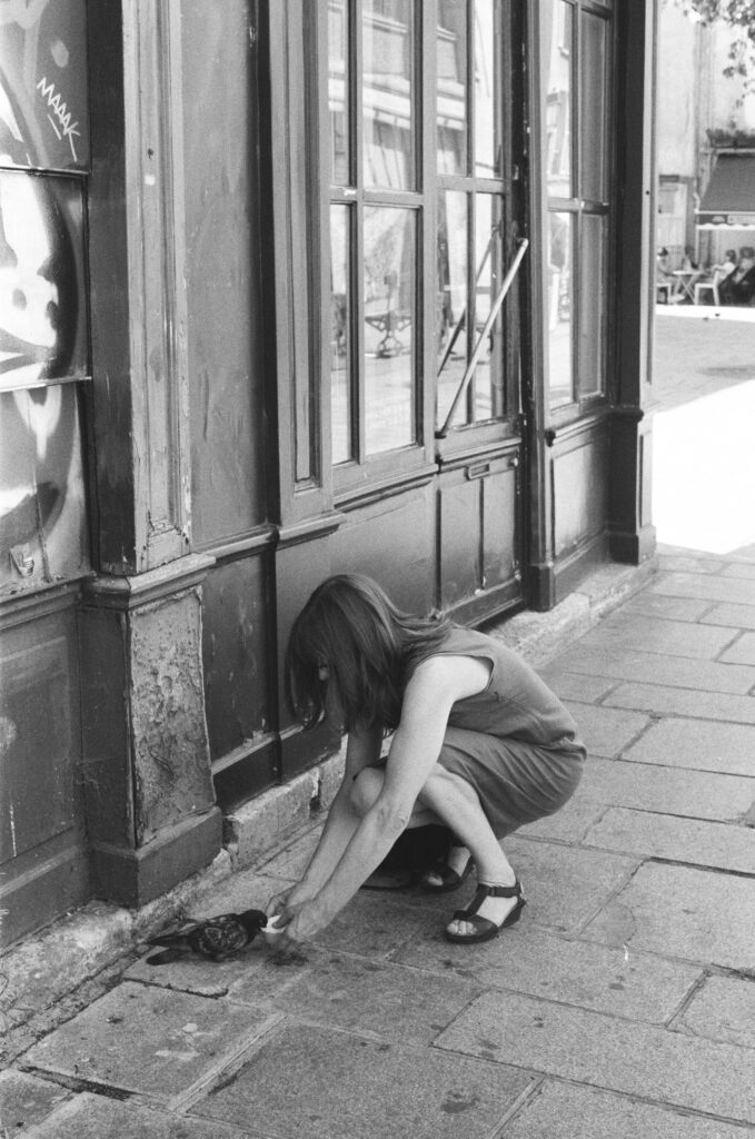 Parisian feeding a pigeon